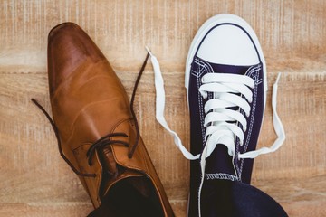 View of two different shoes - obrazy, fototapety, plakaty