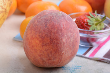 many different fruits for the health of the entire family, peach, mandarin, orange, banana