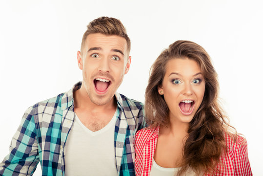 Cute funny cheerful couple  showing surprise