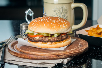 Cheeseburger served  with French Fries and Beer