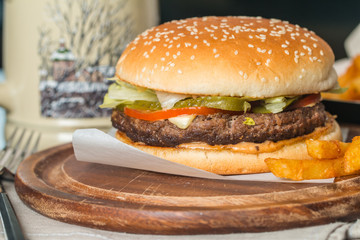 Cheeseburger served  with French Fries and Beer