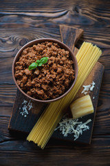 Ingredients for spaghetti bolognese, rustic wooden background