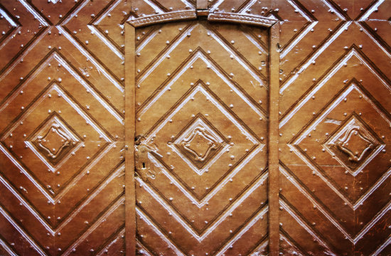 Retro filtered picture of old wooden gate.