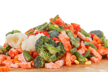 heap of frozen vegetables isolated on white background