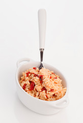 porcelain pan with homemade rice cooked with peppers and cod cru