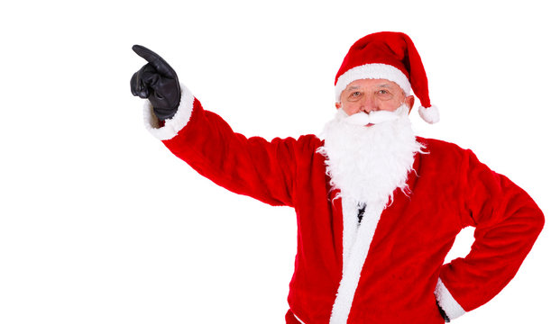 Christmas Santa Claus closeup portrait. Pointing at copyspace. Isolated on White Background