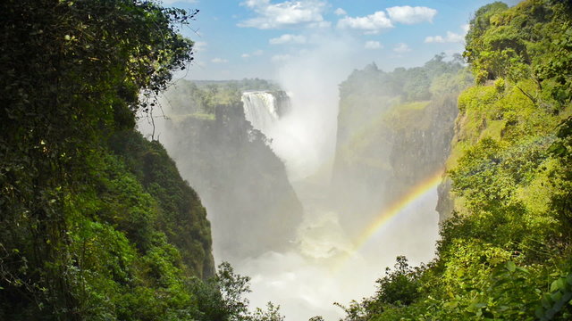 Victoria Falls Devils Cataract or Mosi-oa-Tunya waterfall in southern Africa on the Zambezi River at the border of Zambia and Zimbabwe in high definition footage with ambient audio.