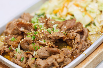 meat slice on the hot plate with vegetables