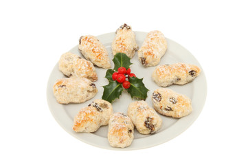 Stollen and holly on a plate
