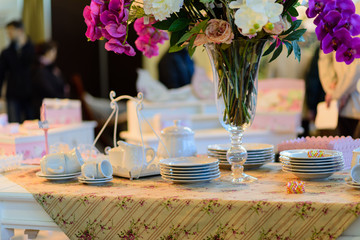 Vintage composition flowers in vase decoration on a table