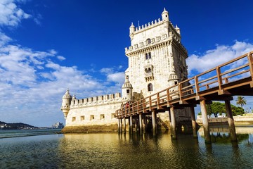 Fototapeta premium Belem tower - fortified building (fort) on an island in the Rive