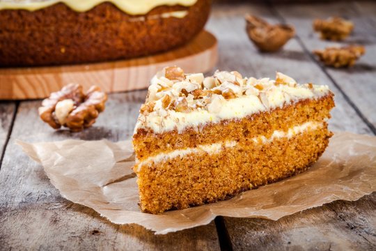 Piece of homemade carrot cake with walnuts