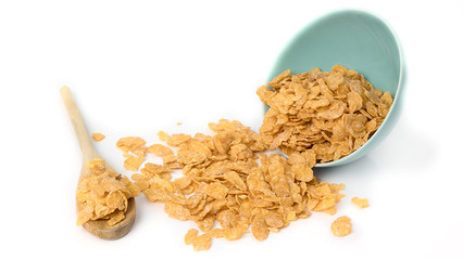 Oat flakes in bowl and wooden spoon on white background.