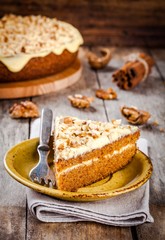 Piece of homemade carrot cake with walnuts