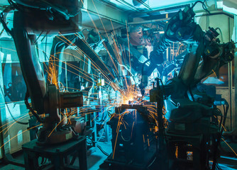 Team Welding robots movement in a car factory