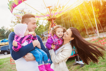 Family at fun fair © Halfpoint