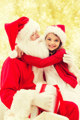 smiling little girl with santa claus