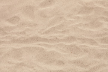 Fototapeta na wymiar Sand beach with waves formed by the air