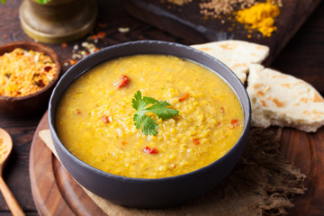 Red lentil Indian soup with flat bread. Masoor dal.  - obrazy, fototapety, plakaty