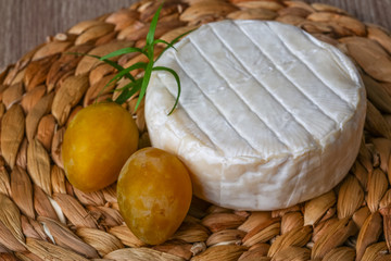 Brie cheese with yellow plums