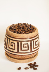 A pot of coffee beans on a white background