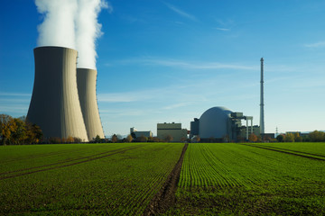 Nuclear power plant on sky background in sunlight