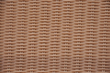 A plastic chair brown basket weave pattern, for background