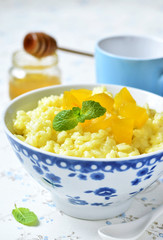 Milk rice porridge with pumpkin and honey.