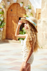 Blond teen girl tourist in Mediterranean old town
