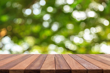 Empty top wooden table and sunny abstract blurred bokeh backgrou