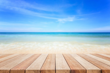Empty top of wooden table or counter and view of tropical beach