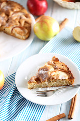 Homemade apple cake on blue wooden table
