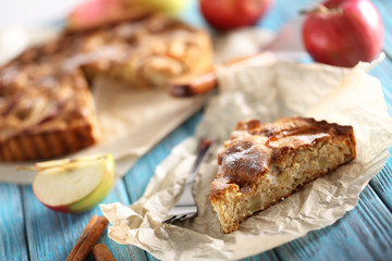 Homemade apple cake on blue wooden table