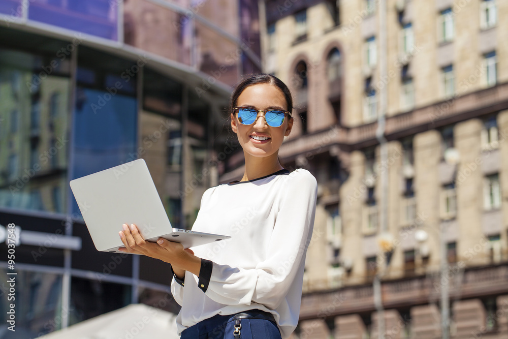 Wall mural Beautiful business woman reading notepad