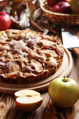 Homemade apple cake on brown wooden table