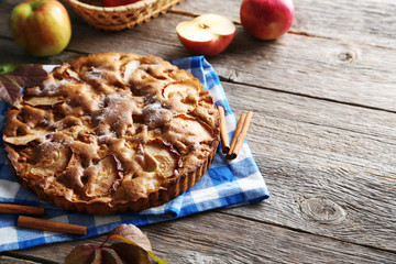 Homemade apple cake on grey wooden table