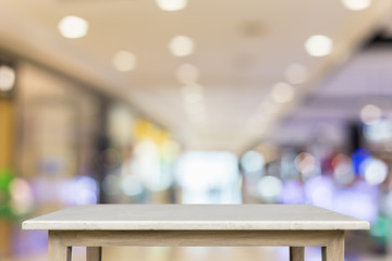 Empty top of natural stone table and blur with bokeh background