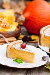 Delicious pumpkin pie  with cinnamon decorated with wild apples