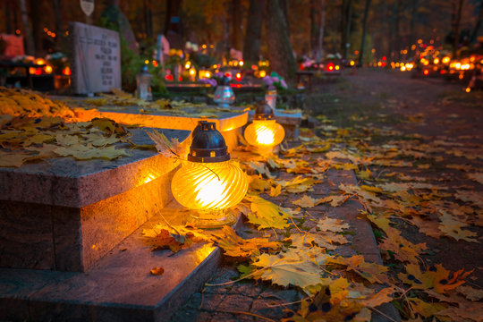 Colorful candles on the cemetery at All Saints Day, Poland