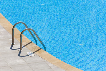 Edge of swimming pool. Barriers to exit the pool.