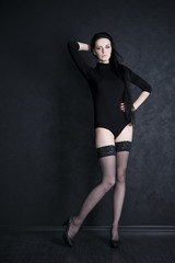 Fototapeta na wymiar Beautiful young woman in stockings