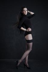 Fototapeta na wymiar Beautiful young woman in stockings