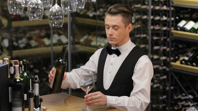 Sommelier examining wine