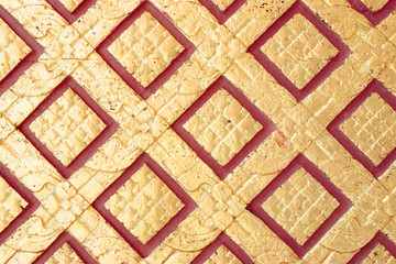 pattern in traditional Thai style art on wall of the temple