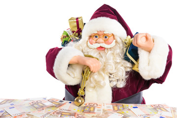 Model of Santa Claus with presents and euro money