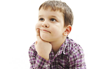 Attractive 6 year old boy making thinking expression. Isolated on white background 