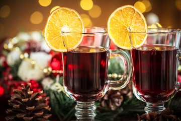 Christmas hot mulled wine with spices on a wooden table. The idea for creating greeting cards