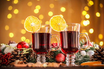 Christmas hot mulled wine with spices on a wooden table. The idea for creating greeting cards