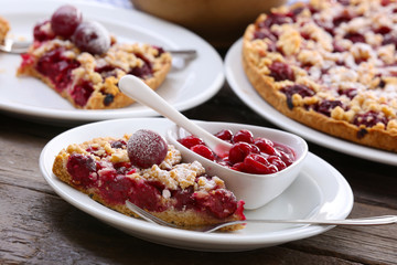 Tasty homemade pie with cherries on table close up