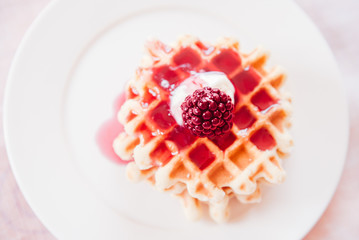 Golden waffles with jam